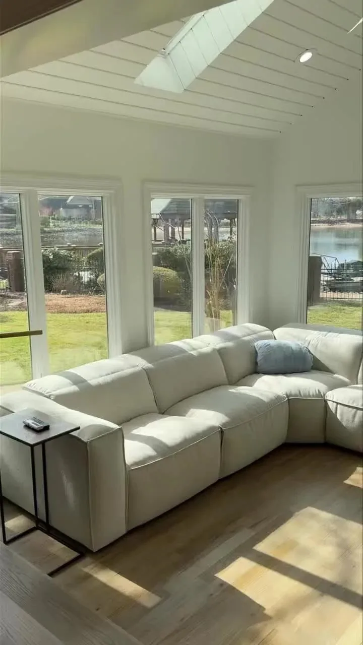 Bright living room with a wall of windows and a low sectional